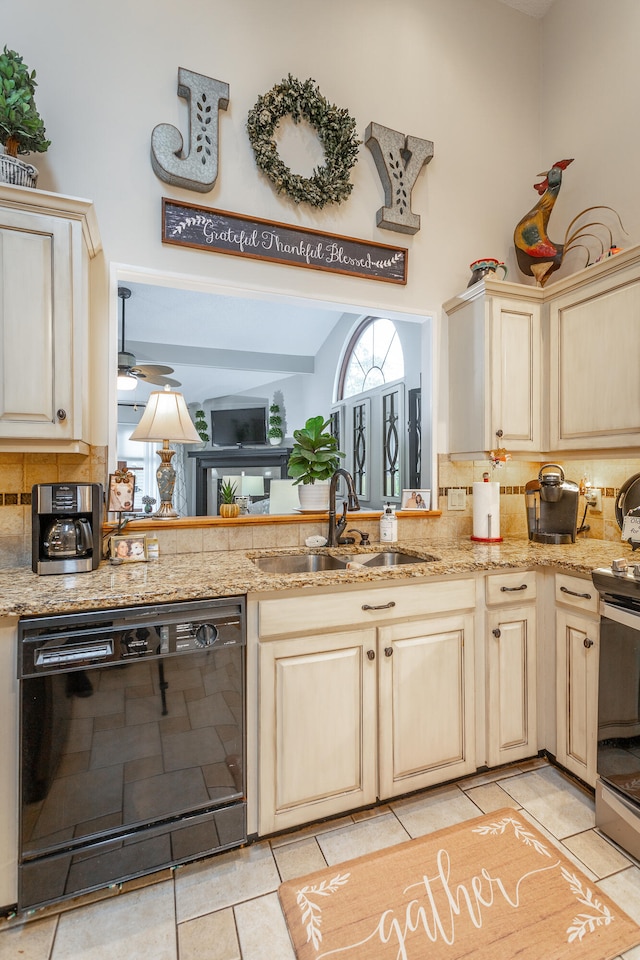 kitchen featuring decorative backsplash, black dishwasher, sink, electric range, and ceiling fan