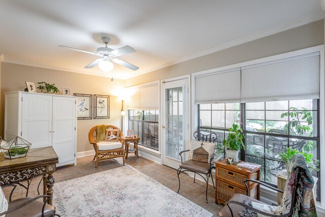 sitting room featuring ornamental molding, ceiling fan, and plenty of natural light