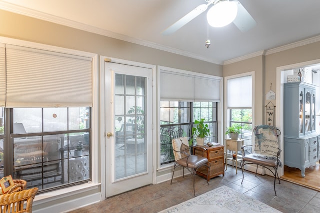 living area featuring crown molding, tile patterned floors, and ceiling fan