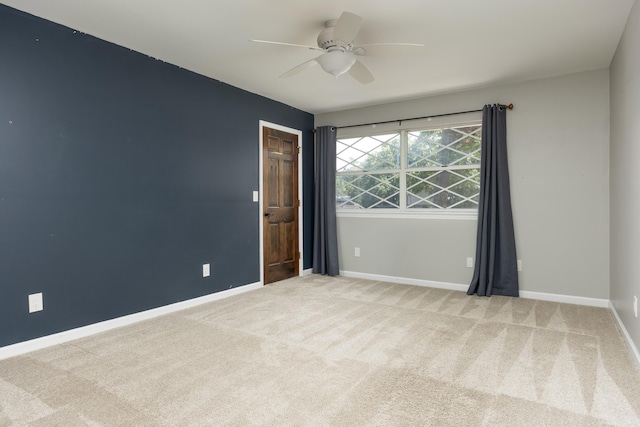 carpeted empty room with ceiling fan