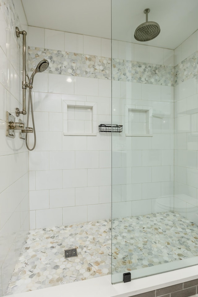 bathroom with a tile shower