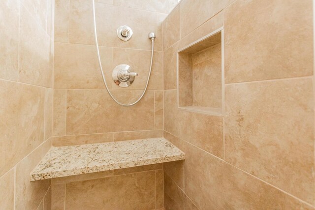 details with a tile shower