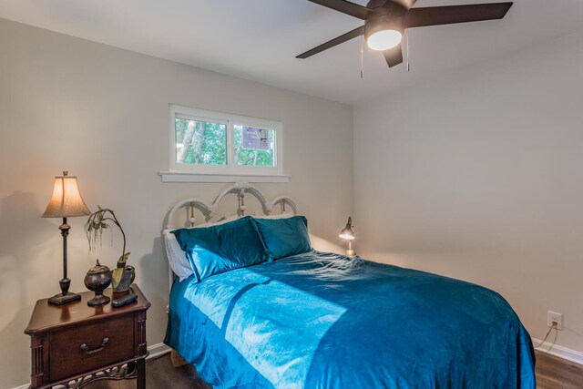 bedroom featuring dark wood-type flooring and ceiling fan