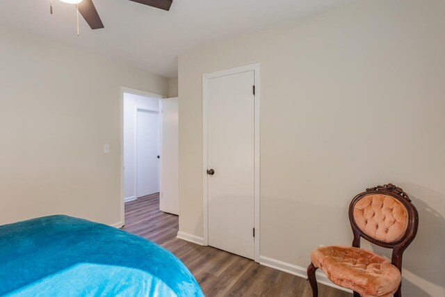 bedroom with ceiling fan and dark wood-type flooring