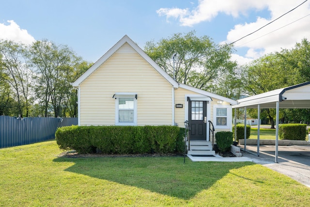 bungalow featuring a carport and a front yard