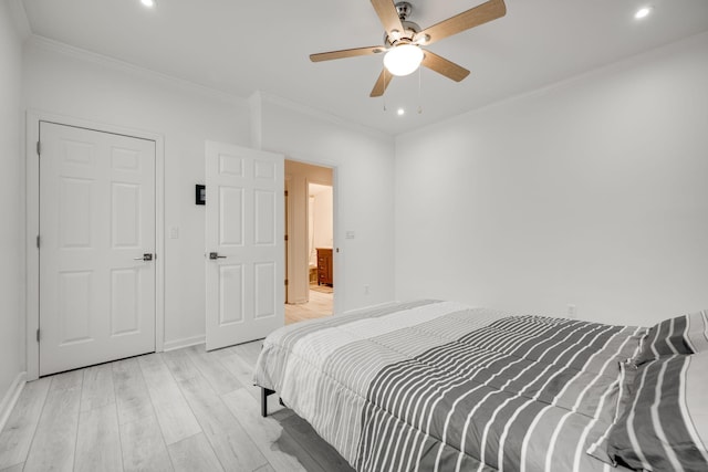 bedroom featuring ceiling fan, light wood-type flooring, and ornamental molding