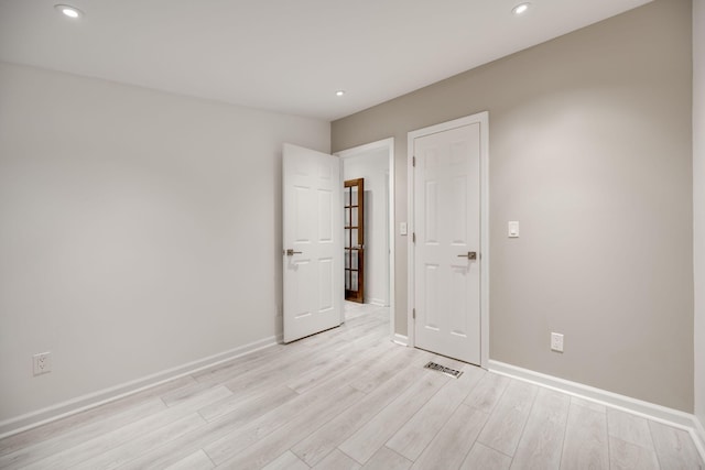 unfurnished room featuring light hardwood / wood-style flooring