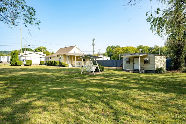 view of yard featuring covered porch