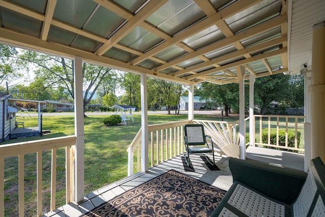 wooden deck with a yard