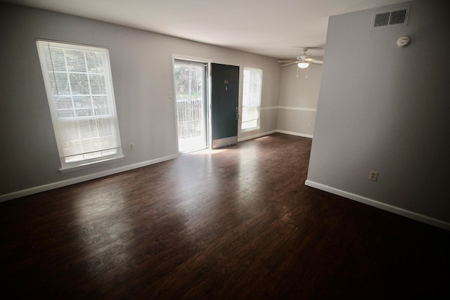 unfurnished room featuring ceiling fan and dark hardwood / wood-style floors