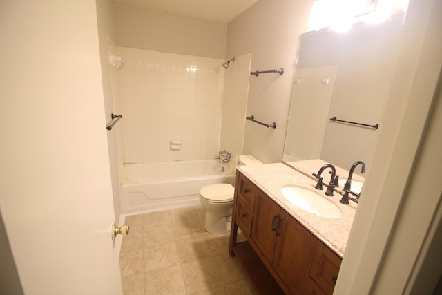 full bathroom with tiled shower / bath, vanity, and toilet