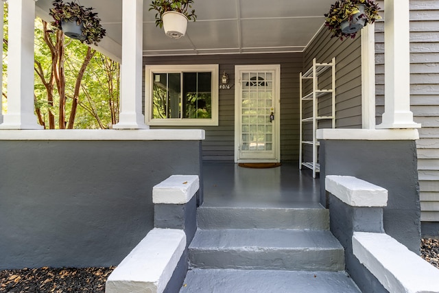 view of exterior entry with covered porch