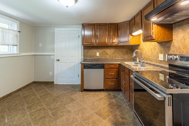 kitchen with appliances with stainless steel finishes, sink, tasteful backsplash, and ventilation hood