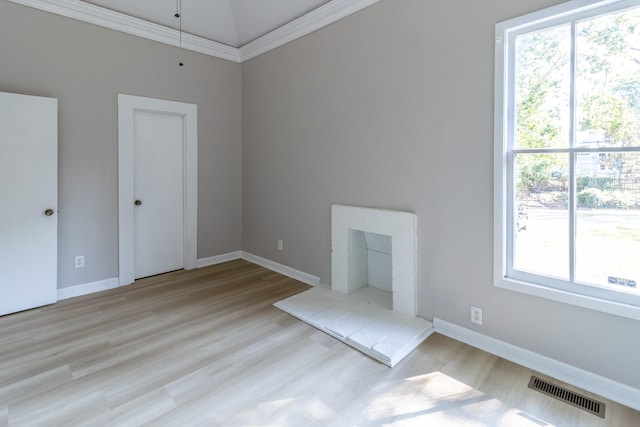 unfurnished living room with light wood-type flooring and crown molding