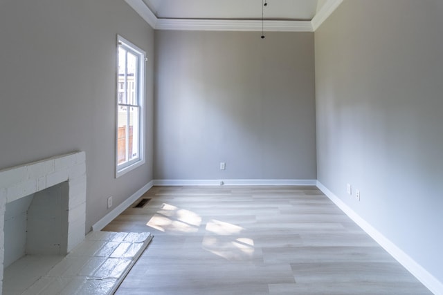 interior space featuring ornamental molding, light hardwood / wood-style flooring, and plenty of natural light