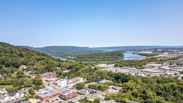 birds eye view of property with a water and mountain view