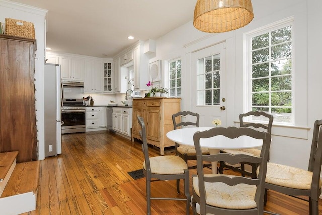 dining space featuring wood-type flooring