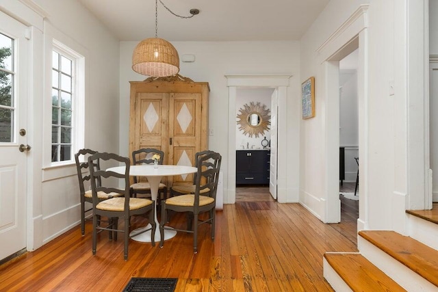 dining room with wood-type flooring