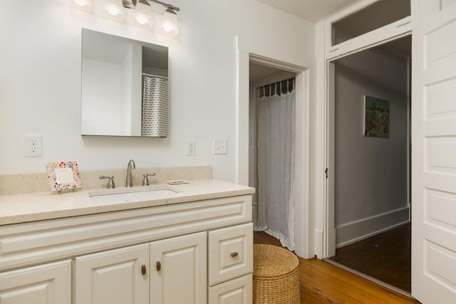 bathroom featuring vanity and hardwood / wood-style floors