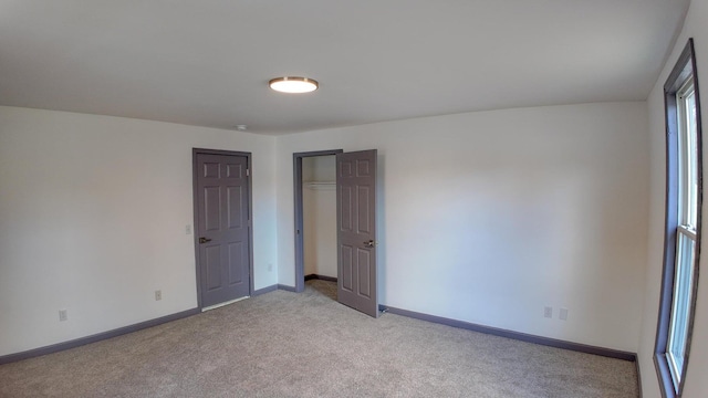 empty room with light colored carpet