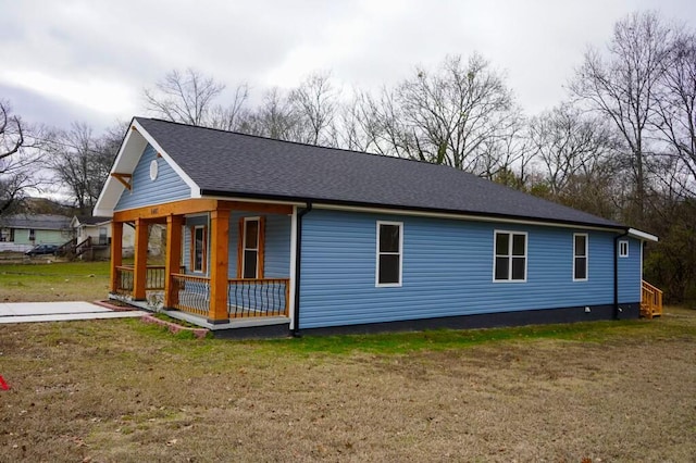 view of front of house with a porch and a front lawn