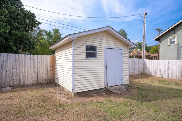 view of outdoor structure featuring a lawn