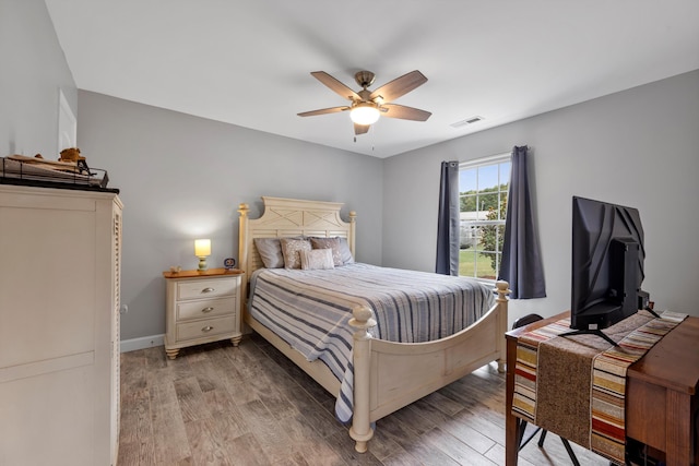 bedroom featuring ceiling fan and hardwood / wood-style flooring