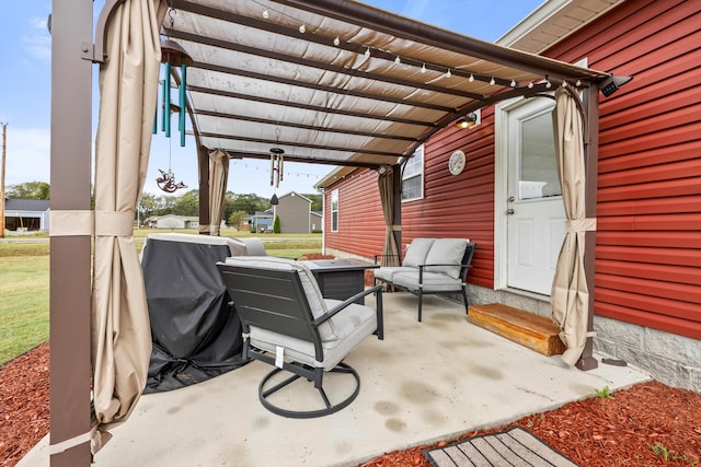 view of patio with grilling area and a pergola