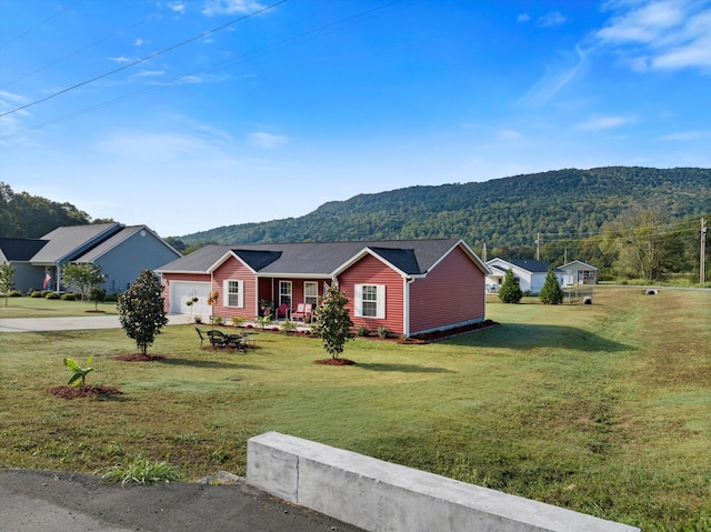 ranch-style home with a front lawn and a mountain view