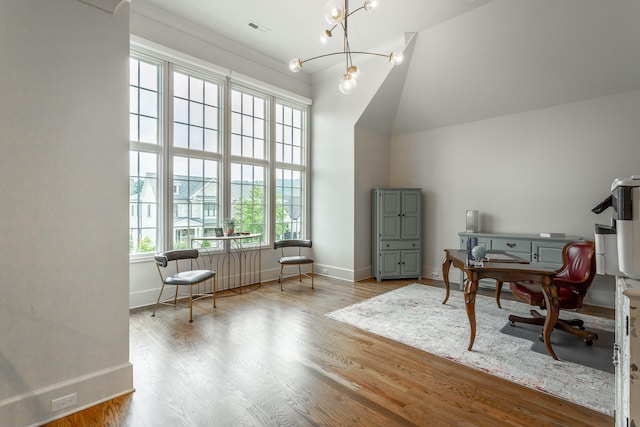 office area with high vaulted ceiling, wood-type flooring, and a chandelier