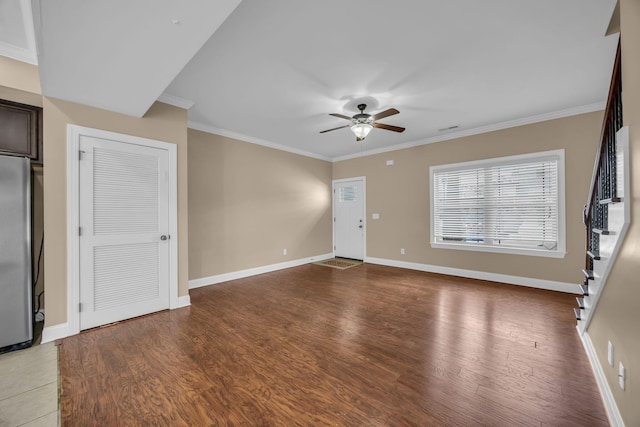 unfurnished living room with hardwood / wood-style floors, ceiling fan, and crown molding