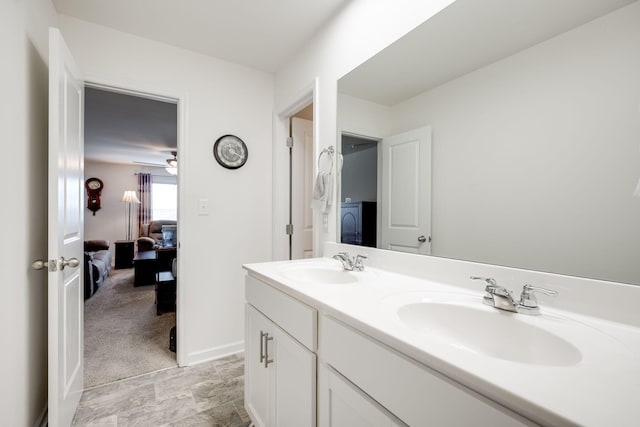 bathroom featuring ceiling fan and vanity