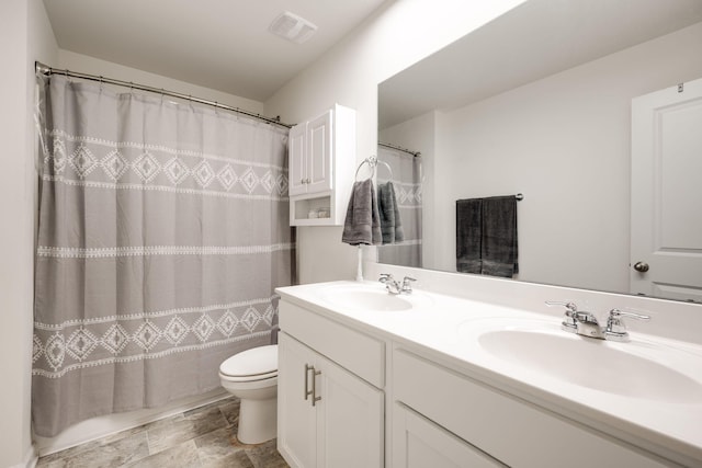 bathroom with a shower with curtain, vanity, and toilet