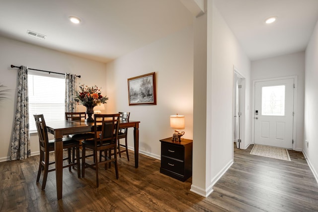 dining space with dark hardwood / wood-style floors