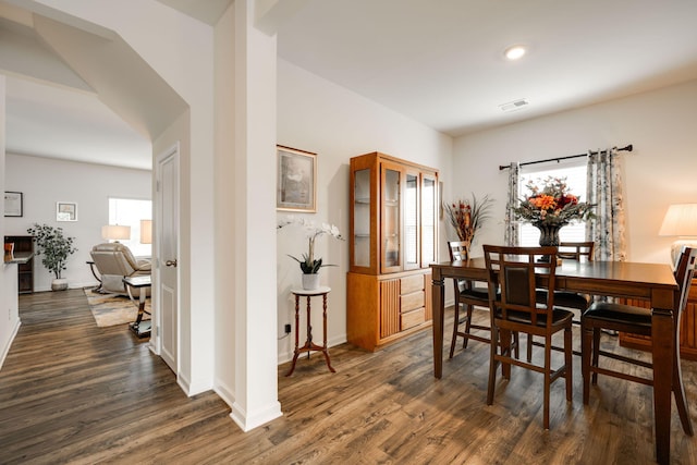 dining area with dark hardwood / wood-style flooring