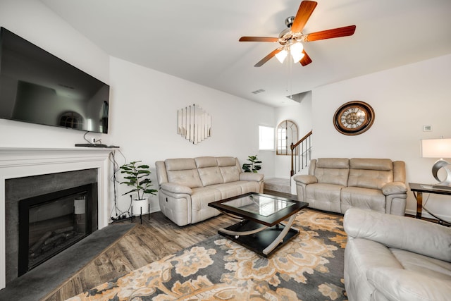 144 Ridgelake Cir Unit 122, Fort Oglethorpe, GA 30742 - living room featuring a ceiling fan, wood finished floors, a glass covered fireplace, stairway, and baseboards