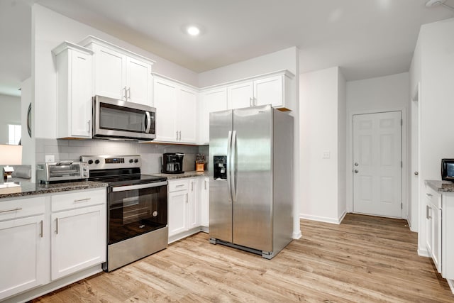 144 Ridgelake Cir Unit 122, Fort Oglethorpe, GA 30742 - kitchen with appliances with stainless steel finishes, light wood-style floors, and white cabinets