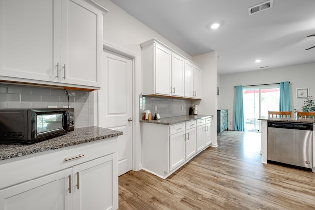 kitchen featuring light hardwood / wood-style flooring, white cabinets, dishwasher, and decorative backsplash