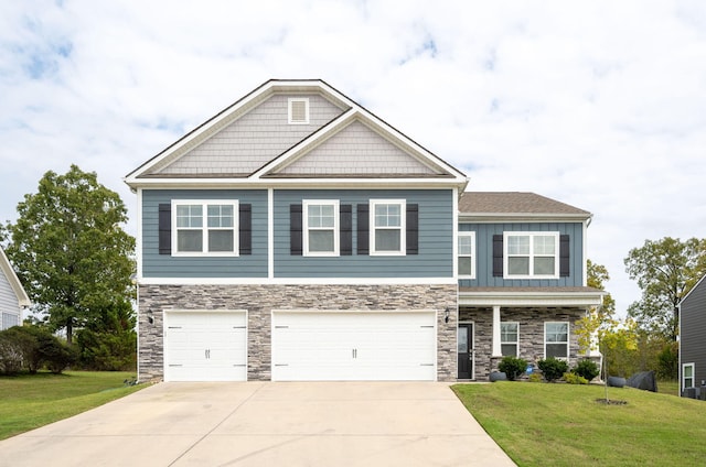 craftsman inspired home featuring a garage and a front yard