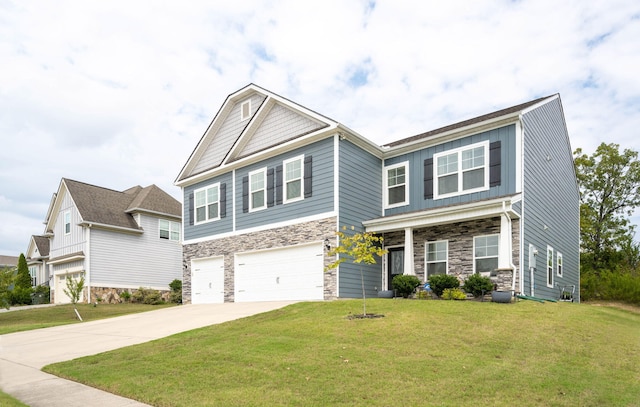 craftsman inspired home featuring a front yard and a garage