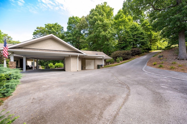 view of front of property featuring a carport