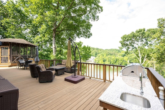 deck with a grill and sink