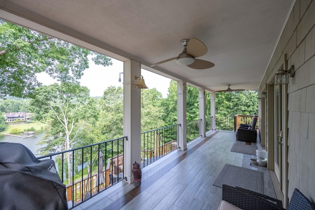 deck with ceiling fan and area for grilling