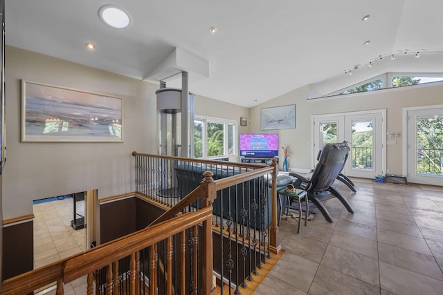 hall with vaulted ceiling and french doors