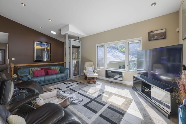 living room with light tile patterned floors and vaulted ceiling