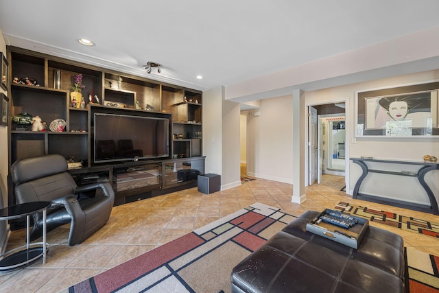 living room featuring built in shelves and light tile patterned flooring