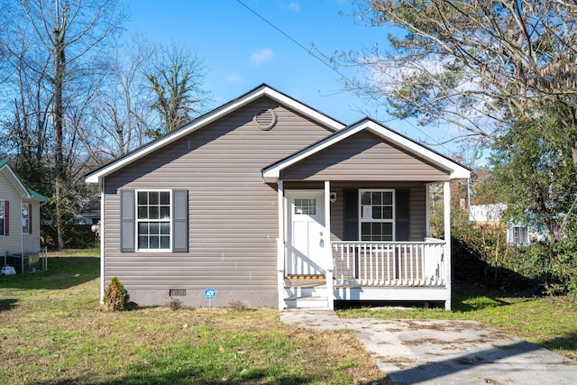 bungalow-style house featuring a porch and a front yard