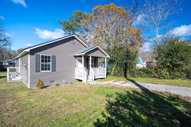 view of front of house featuring a front yard and a porch