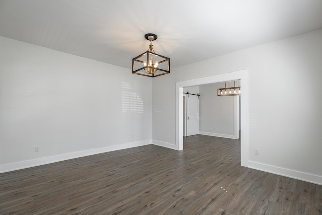 14 N Parkdale Ave, Chattanooga, TN 37411 - unfurnished dining area featuring dark wood-type flooring, a barn door, baseboards, and a chandelier