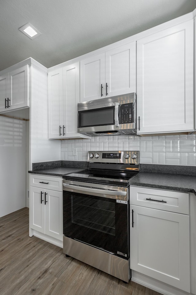 14 N Parkdale Ave, Chattanooga, TN 37411 - kitchen featuring white cabinetry, dark countertops, and appliances with stainless steel finishes